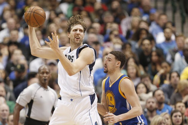 Dallas Mavericks forward Dirk Nowitzki, left, battles Golden State Warriors guard Klay Thompson (11) for space during the second half of an NBA basketball game Friday, March 18, 2016, in Dallas. Golden State won 130-112. (AP Photo/Brandon Wade)