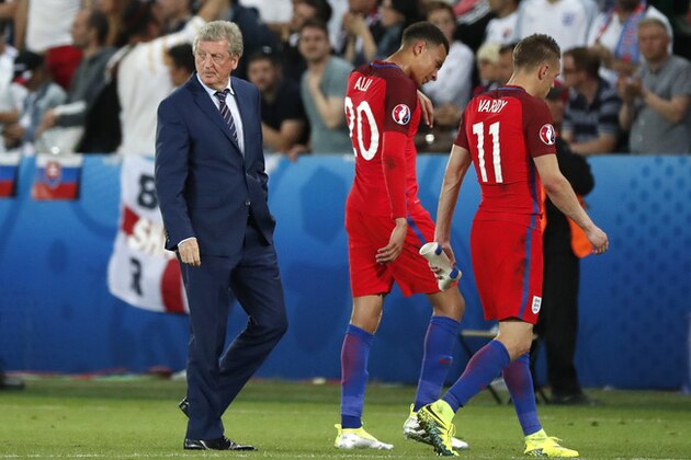 England coach Roy Hodgson, Dele Alli and Jamie Vardy, from left to right, leave the pitch at the end of the Euro 2016 Group B soccer match between Slovakia and England at the Geoffroy Guichard stadium in Saint-Etienne, France, Monday, June 20, 2016. (AP Photo/Francois Mori)