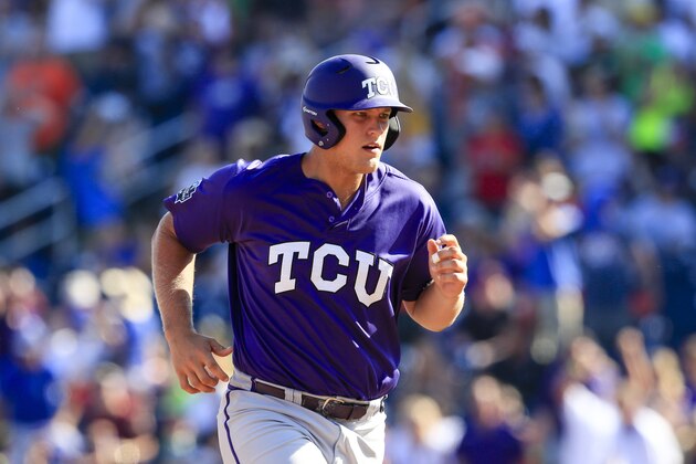 TCU's Luken Baker runs the bases after hitting a three-run home run against Texas Tech during the ninth inning of an NCAA men's College World Series baseball game in Omaha, Neb., Sunday, June 19, 2016. TCU won 5-3. (AP Photo/Nati Harnik)