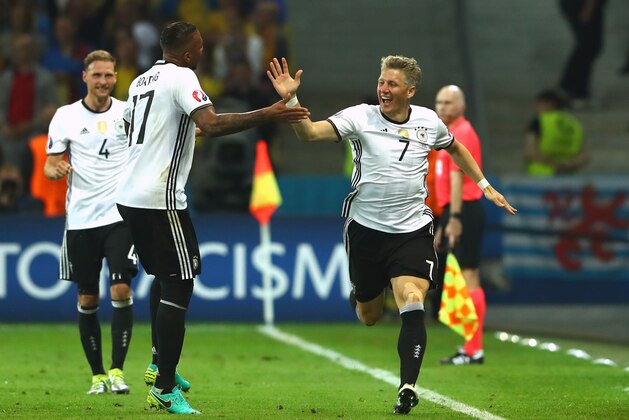 LILLE, FRANCE - JUNE 12:  Bastian Schweinsteiger of Germany celebrates scoring his team's second goal with his team mate Jerome Boateng during the UEFA EURO 2016 Group C match between Germany and Ukraine at Stade Pierre-Mauroy on June 12, 2016 in Lille, France.  (Photo by Alexander Hassenstein/Getty Images)