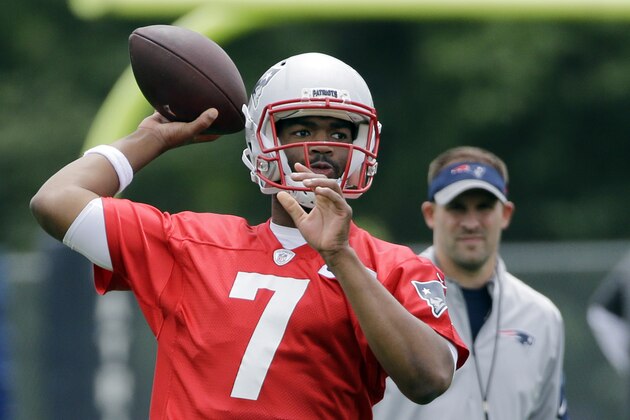 New England Patriots quarterback Jacoby Brissett throws as offensive coordinator Josh McDaniels watches during an NFL football practice Wednesday, June 8, 2016 in Foxborough, Mass. (AP Photo/Elise Amendola)