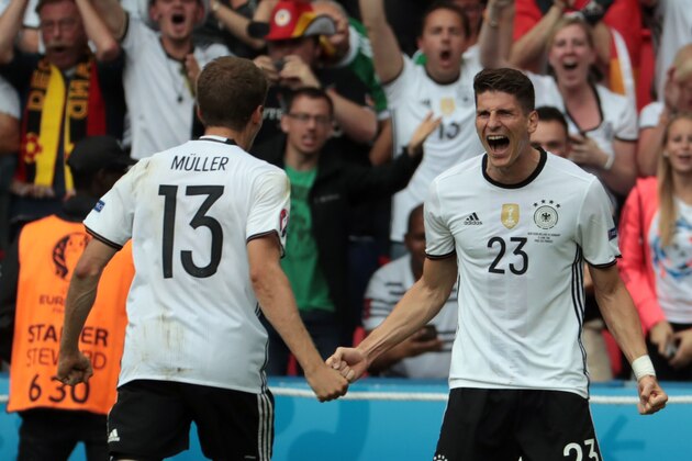 Germany's forward Mario Gomez (R) celebrates scoring the opening goal with Germany's midfielder Thomas Mueller during the Euro 2016 group C football match between Northern Ireland and Germany at the Parc des Princes stadium in Paris on June 21, 2016. / AFP / KENZO TRIBOUILLARD        (Photo credit should read KENZO TRIBOUILLARD/AFP/Getty Images)