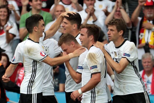 Germany's forward Mario Gomez (C) celebrates scoring the opening goal with team mates during the Euro 2016 group C football match between Northern Ireland and Germany at the Parc des Princes stadium in Paris on June 21, 2016. / AFP / KENZO TRIBOUILLARD        (Photo credit should read KENZO TRIBOUILLARD/AFP/Getty Images)