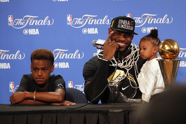 June 19, 2016; Oakland, CA, USA; Cleveland Cavaliers forward LeBron James (23) speaks to media with his children Lebron James Jr. and daughter Zhuri James following the 93-89 victory against the Golden State Warriors in game seven of the NBA Finals at Oracle Arena. Mandatory Credit: Cary Edmondson-USA TODAY Sports