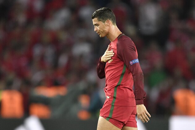 Portugal's Cristiano Ronaldo gestures to the supporters at the end of the Euro 2016 Group F soccer match between Portugal and Austria at the Parc des Princes stadium in Paris, France, Saturday, June 18, 2016. (AP Photo/Martin Meissner)