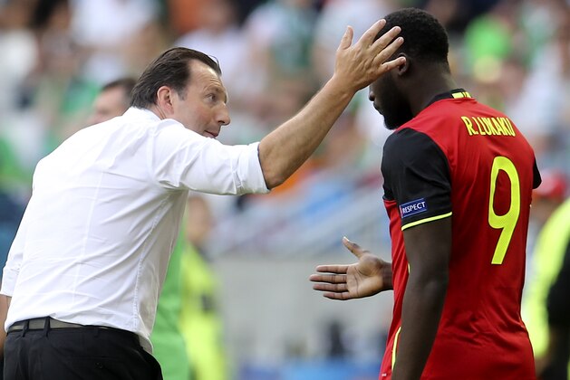 Belgium's Romelu Lukaku is congratulated by Belgium coach Marc Wilmots after scoring his side's first goal during the Euro 2016 Group E soccer match between Belgium and Ireland at the Nouveau Stade in Bordeaux, France, Saturday, June 18, 2016. (AP Photo/Petr David Josek)
