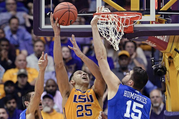FILE - In this Jan. 5, 2016, file photo, LSU forward Ben Simmons (25), of Australia, puts the ball up for two points in heavy traffic between Kentucky forwards Derek Willis (35) and Isaac Humphries (15) during the second half of an NCAA college basketball game in Baton Rouge, La. Simmons might be next to go from Down Under to the very top of the NBA draft.  The LSU freshman is considered the likely choice when the Philadelphia 76ers make the first pick in the draft Thursday night in New York. (AP Photo/Bill Feig, File)