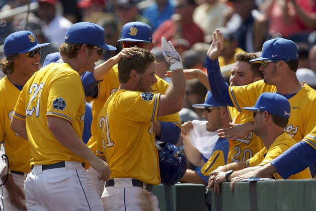 Jun 20, 2016; Omaha, NE, USA; UC Santa Barbara Gauchos runner Ryan Cumberland (31) scored a run and celebrates with teammates in the sixth inning against the Miami Hurricanes in the 2016 College World Series at TD Ameritrade Park. UC Santa Barbara won 5-3. Mandatory Credit: Bruce Thorson-USA TODAY Sports