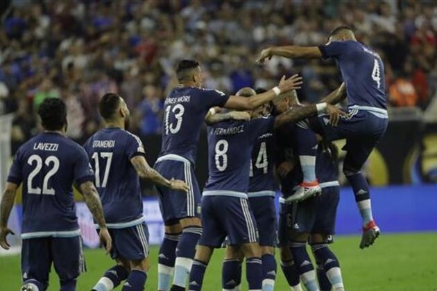 Argentina midfielder Lionel Messi is surrounded by teammates after scoring a goal against the United States during a Copa America Centenario semifinal soccer match Tuesday, June 21, 2016, in Houston. (AP Photo/David J. Phillip)