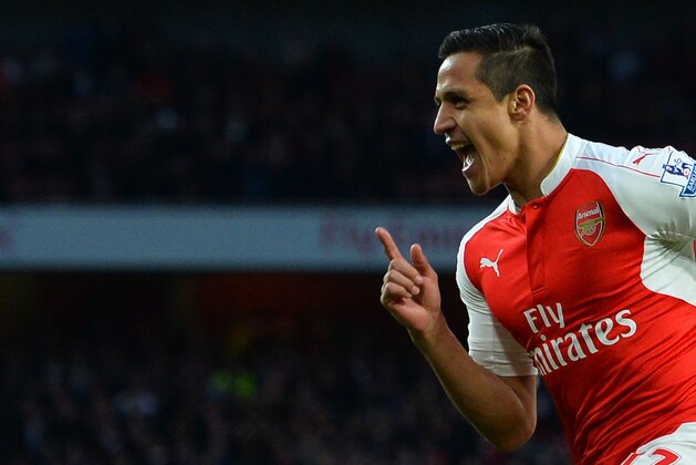Arsenal's Chilean striker Alexis Sanchez celebrates scoring the opening goal during the English Premier League football match between Arsenal and West Bromwich Albion at the Emirates Stadium in London on April 21, 2016.  / AFP / GLYN KIRK / RESTRICTED TO EDITORIAL USE. No use with unauthorized audio, video, data, fixture lists, club/league logos or 'live' services. Online in-match use limited to 75 images, no video emulation. No use in betting, games or single club/league/player publications.  /         (Photo credit should read GLYN KIRK/AFP/Getty Images)