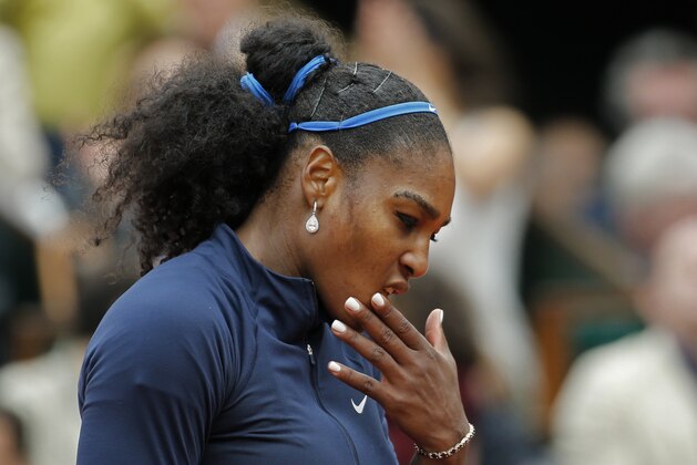 Serena Williams of the U.S. misses a return in the final of the French Open tennis tournament against Spain's Garbine Muguruza at the Roland Garros stadium in Paris, France, Saturday, June 4, 2016. (AP Photo/Alastair Grant)