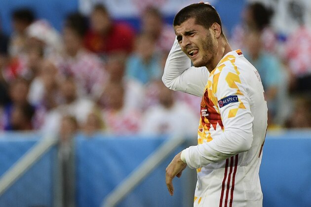 Spain's forward Alvaro Morata holds his head following a clash with Croatia's defender Vedran Corluka during the Euro 2016 group D football match between Croatia and Spain at the Matmut Atlantique stadium in Bordeaux on June 21, 2016. / AFP / PIERRE-PHILIPPE MARCOU        (Photo credit should read PIERRE-PHILIPPE MARCOU/AFP/Getty Images)