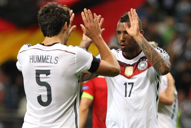 Germany's defender Mats Hummels and Germany's defender Jerome Boateng (R) celebrate the 3-1 victory after the Euro 2016 qualifying football match between Germany and Poland in Frankfurt am Main, central Germany, on September 4, 2015.  AFP PHOTO / DANIEL ROLAND        (Photo credit should read DANIEL ROLAND/AFP/Getty Images)