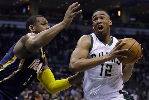 Milwaukee Bucks' Jabari Parker drives past Indiana Pacers' Lavoy Allen during the second half of an NBA basketball game Wednesday, April 13, 2016, in Milwaukee. (AP Photo/Morry Gash)