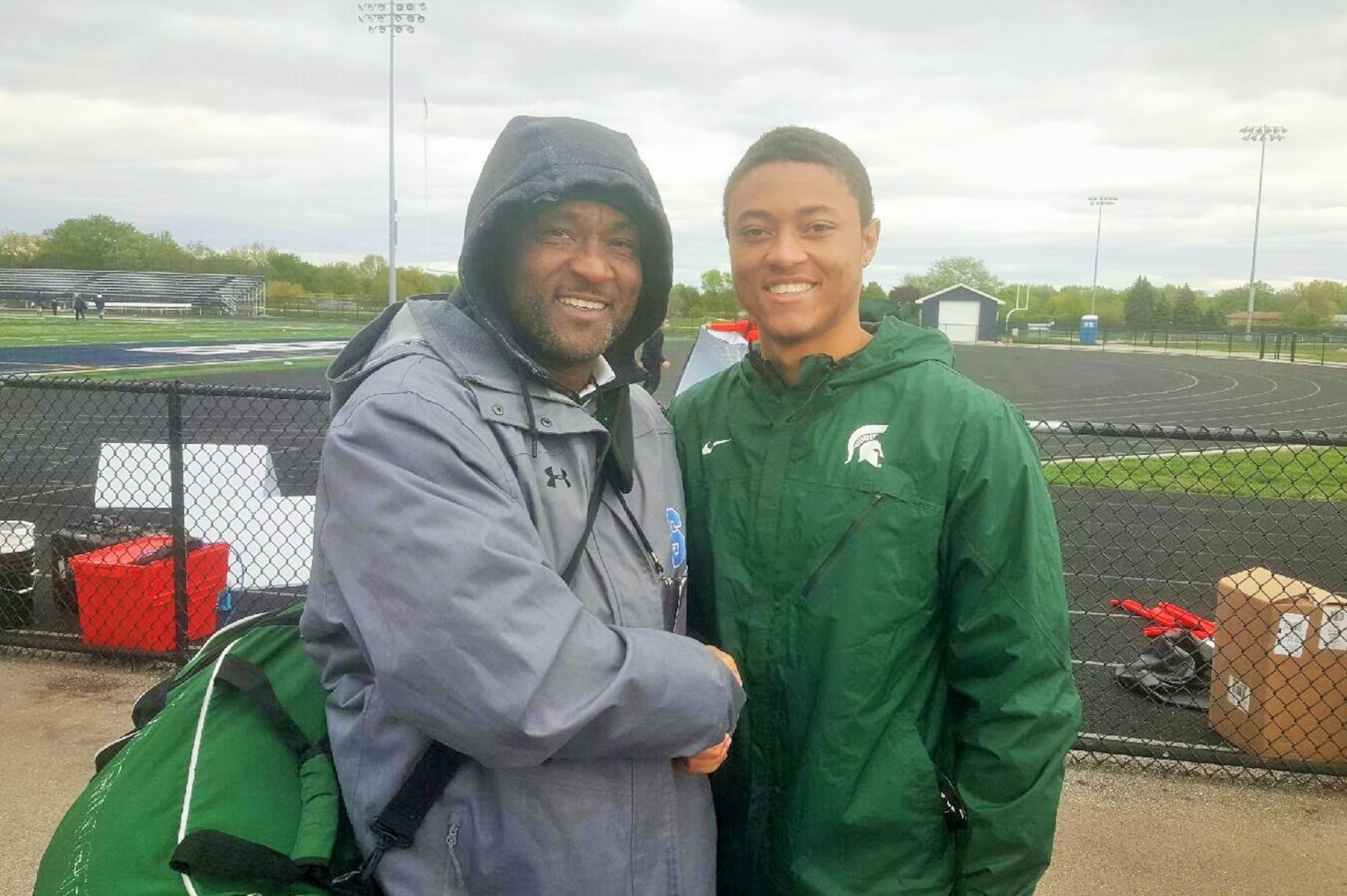 Michigan State wide receiver commit Hunter Rison (right) has big shoes to fill, as he looks to follow in the footsteps of his father, Andre Rison, who shined for the Spartans and played 12 seasons in the NFL.