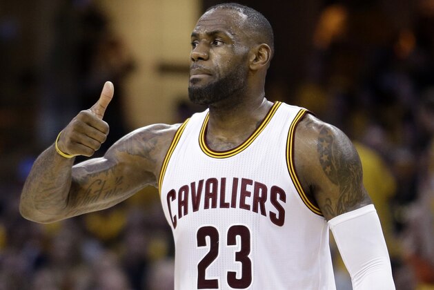 Cleveland Cavaliers' LeBron James (23) gestures during the first half against the Toronto Raptors in Game 2 of the NBA basketball Eastern Conference finals Thursday, May 19, 2016, in Cleveland. (AP Photo/Tony Dejak)