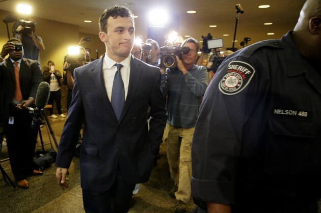 Former Cleveland Browns quarterback Johnny Manziel arrives at court for his initial appearance, Thursday, May 5, 2016, in Dallas. The Heisman Trophy winner and former Texas A&M star was indicted by a grand jury last month after his ex-girlfriend alleged he hit her and threatened to kill her during a night out in January.  (AP Photo/LM Otero)