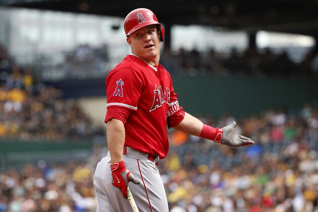Los Angeles Angels' Mike Trout questions home plate umpire Bob Davidson on a called third strike as he walks back to the dugout during the first inning of a baseball game in Pittsburgh, Saturday, June 4, 2016. (AP Photo/Gene J. Puskar)