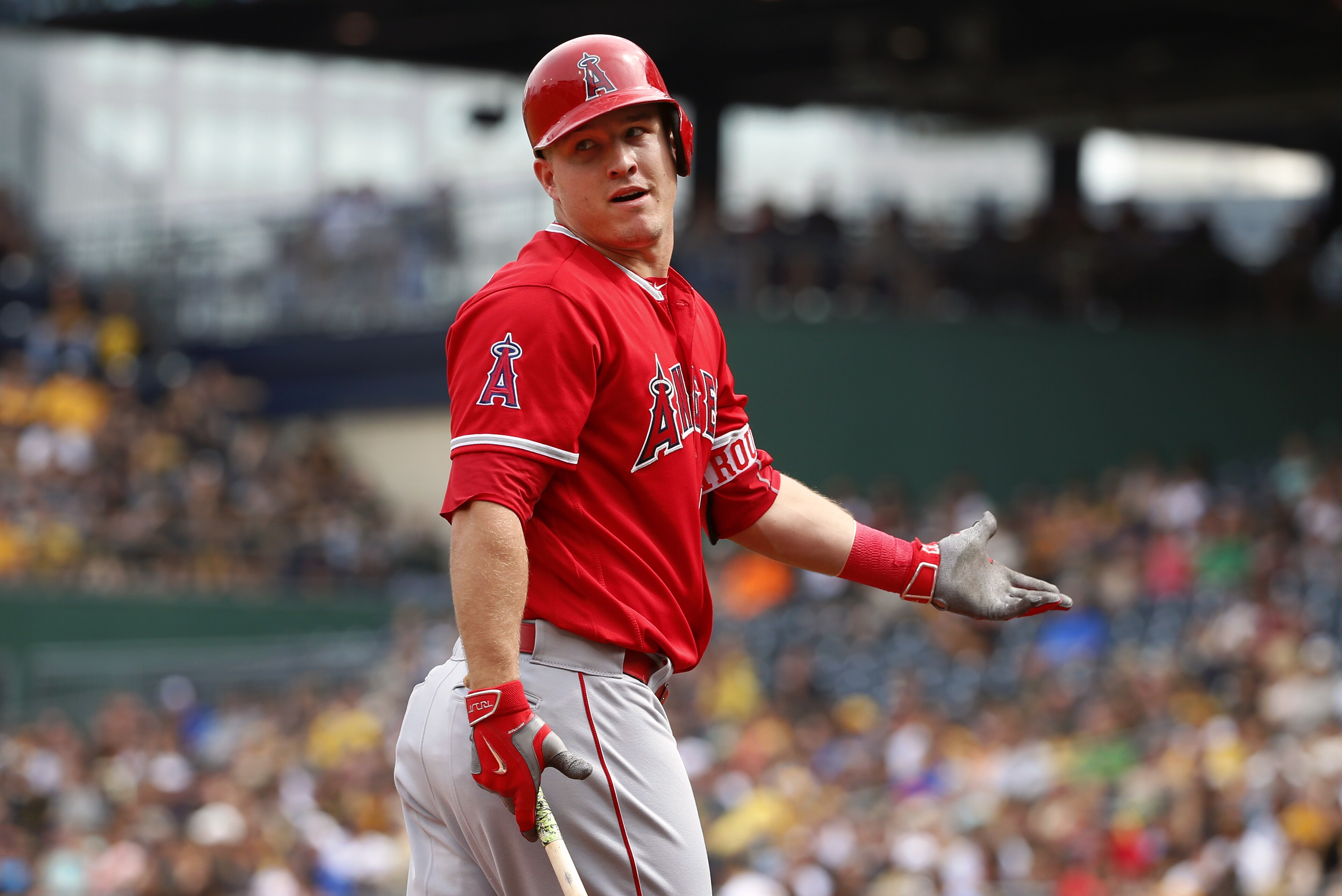 Los Angeles Angels' Mike Trout questions home plate umpire Bob Davidson on a called third strike as he walks back to the dugout during the first inning of a baseball game in Pittsburgh, Saturday, June 4, 2016. (AP Photo/Gene J. Puskar)