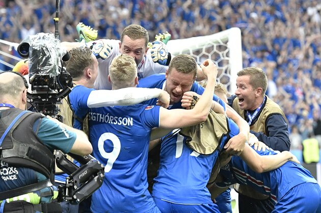 Iceland players celebrate a goal by Iceland's Arnor Ingvi Traustason during the Euro 2016 Group F soccer match between Iceland and Austria at the Stade de France in Saint-Denis, north of Paris, France, Wednesday, June 22, 2016. (AP Photo/Martin Meissner)