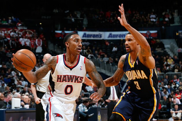 ATLANTA, GA - JANUARY 08:  Jeff Teague #0 of the Atlanta Hawks against George Hill #3 of the Indiana Pacers at Philips Arena on January 8, 2014 in Atlanta, Georgia.  NOTE TO USER: User expressly acknowledges and agrees that, by downloading and or using this photograph, User is consenting to the terms and conditions of the Getty Images License Agreement.  (Photo by Kevin C. Cox/Getty Images)