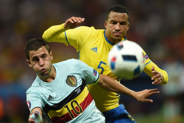 Belgium's forward Eden Hazard (L) vies for the ball against Sweden's defender Martin Olsson during the Euro 2016 group E football match between Sweden and Belgium at the Allianz Riviera stadium in Nice on June 22, 2016. / AFP / BULENT KILIC        (Photo credit should read BULENT KILIC/AFP/Getty Images)