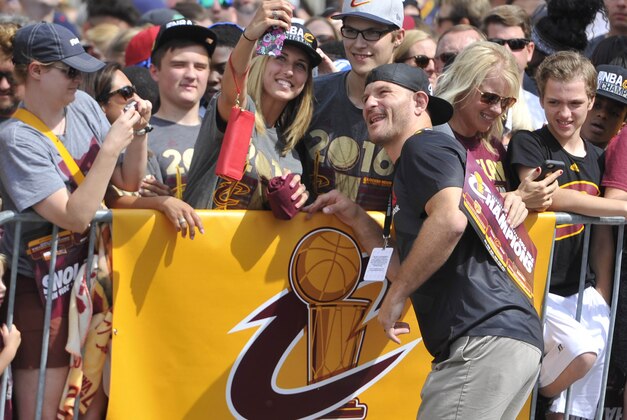 Jun 22, 2016; Cleveland, OH, USA; UFC heavyweight champion Stipe Miocic poses with fans prior to the Cleveland Cavaliers NBA championship parade in downtown Cleveland. Mandatory Credit: David Richard-USA TODAY Sports