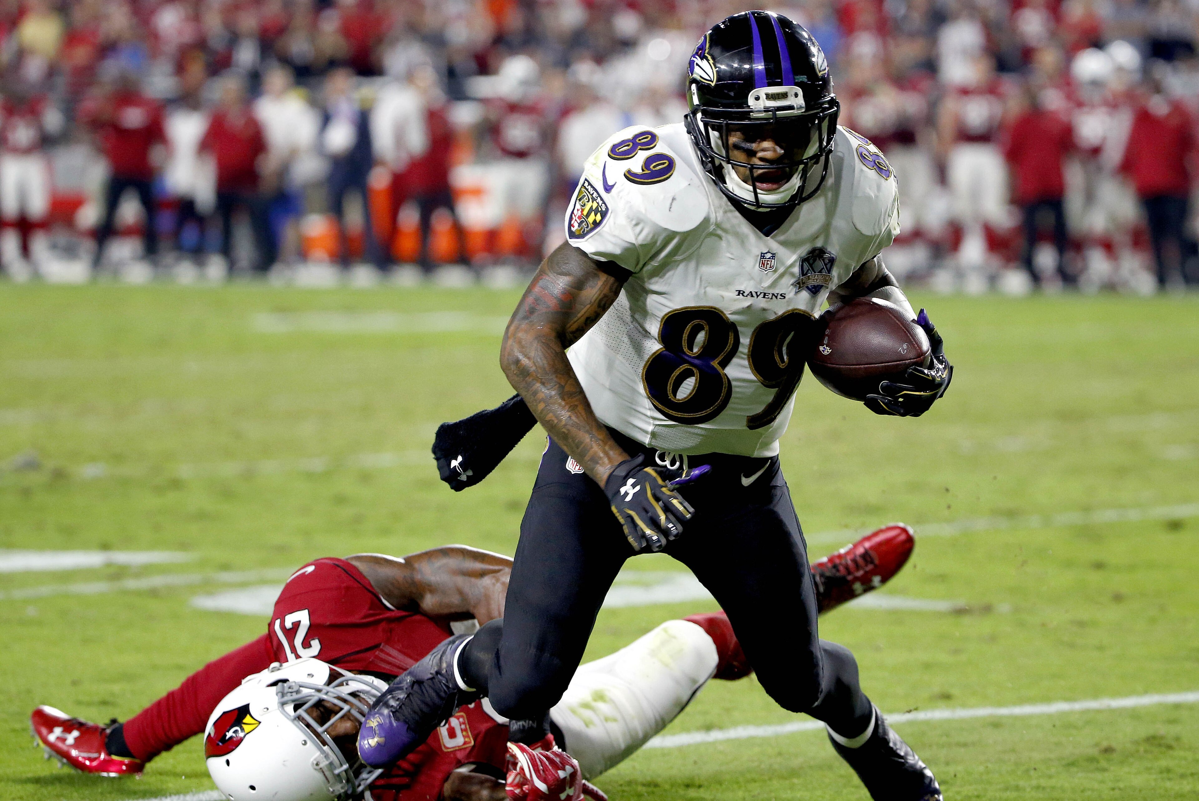 Baltimore Ravens wide receiver Steve Smith (89) makes a catch as Arizona Cardinals cornerback Patrick Peterson (21) defends during the second half of an NFL football game, Monday, Oct. 26, 2015, in Glendale, Ariz. The Cardinals won 26-18. (AP Photo/Ross D. Franklin) Baltimore Ravens wide receiver Steve Smith (89) makes a catch as Arizona Cardinals cornerback Patrick Peterson (21) defends during the second half of an NFL football game, Monday, Oct. 26, 2015, in Glendale, Ariz. The Cardinals won 26-18. (AP Photo/Ross D. Franklin)
