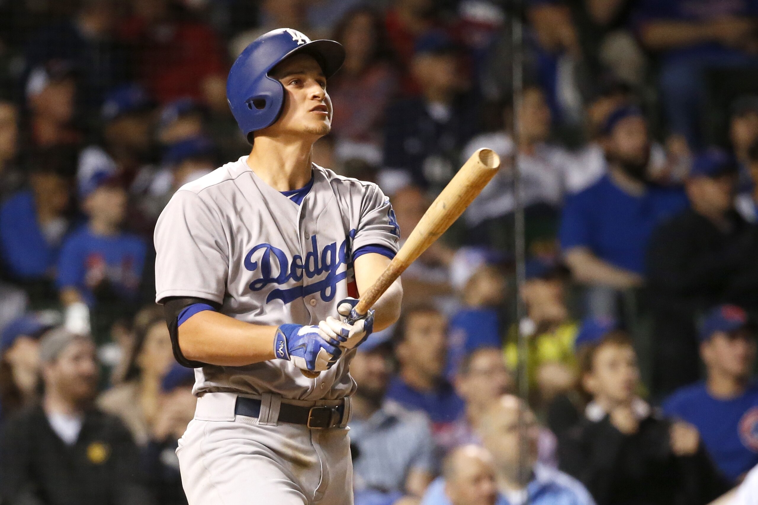 Los Angeles Dodgers' Corey Seager watches his three-run home run off Chicago Cubs relief pitcher Trevor Cahill during the ninth inning of a baseball game and the Dodgers' 5-0 win over the Chicago Cubs Tuesday, May 31, 2016, in Chicago. Enrique Hernandez and Carl Crawford also scored on the play. (AP Photo/Charles Rex Arbogast)
