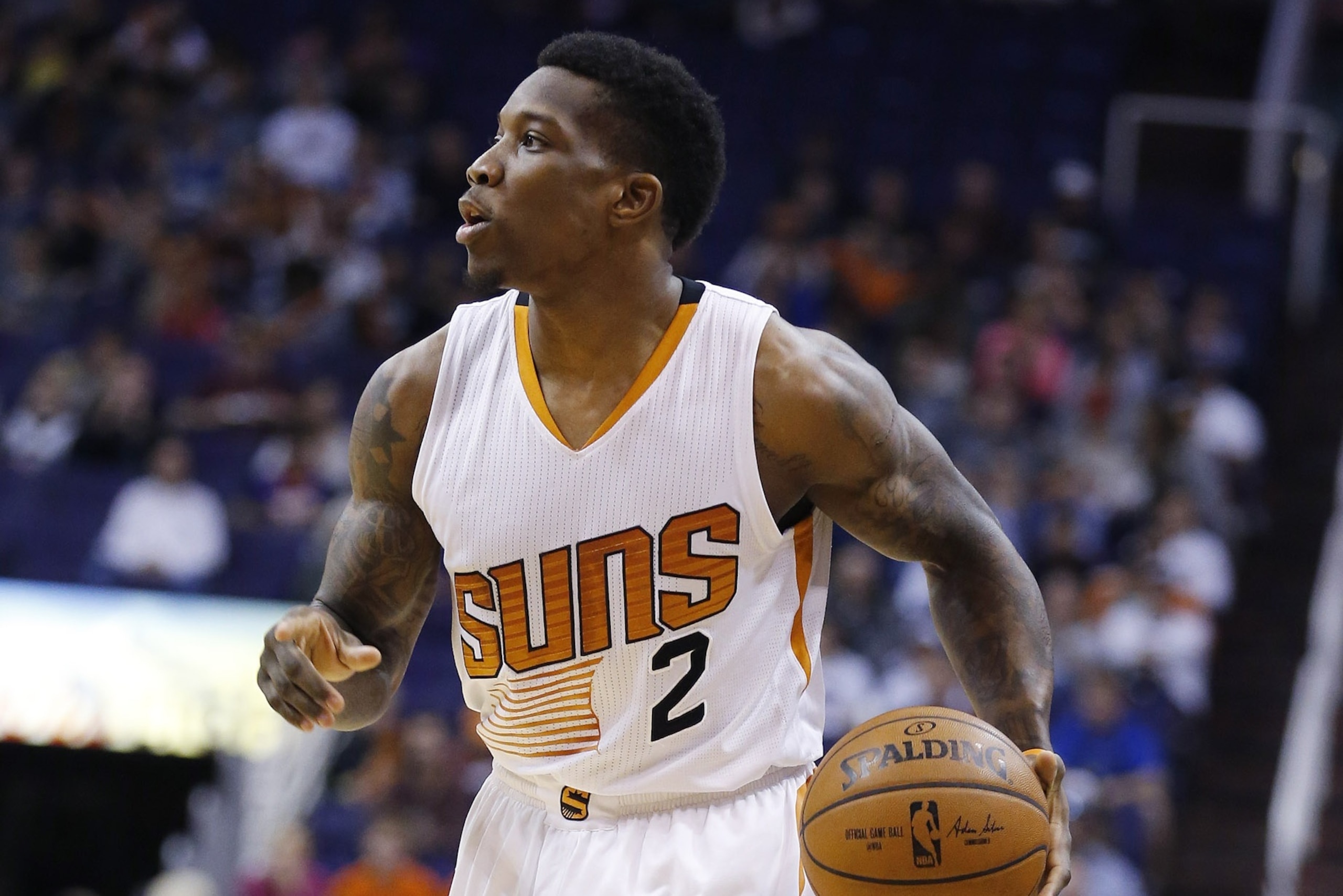 Phoenix Suns' Eric Bledsoe dribbles the ball against the Minnesota Timberwolves during the first half of an NBA basketball game Sunday, Dec. 13, 2015, in Phoenix.  The Suns defeated the Timberwolves 108-101. (AP Photo/Ross D. Franklin)