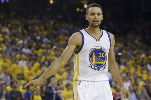Golden State Warriors guard Stephen Curry (30) gestures during the first half of Game 7 of basketball's NBA Finals between the Warriors and the Cleveland Cavaliers in Oakland, Calif., Sunday, June 19, 2016. (AP Photo/Marcio Jose Sanchez)