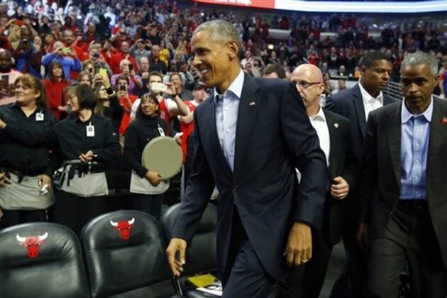 CORRECTS DAY OF WEEK TO TUESDAY NOT SATURDAY - President Barack Obama walks into the United Center during an NBA basketball game between the Cleveland Cavaliers and the Chicago Bulls in Chicago on Tuesday, Oct. 27, 2015. (AP Photo/Jeff Haynes)
