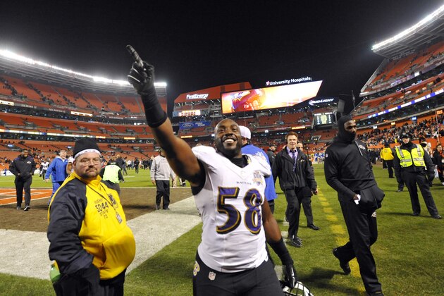 Baltimore Ravens outside linebacker Elvis Dumervil (58) celebrates after the Ravens defeated the Cleveland Browns 33-27 in an NFL football game, Monday, Nov. 30, 2015, in Cleveland. (AP Photo/David Richard)