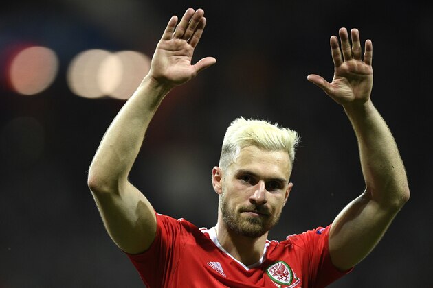 Wales' midfielder Aaron Ramsey, who scored the team's first goal, celebrates their 3-0 win in the Euro 2016 group B football match between Russia and Wales at the Stadium Municipal in Toulouse on June 20, 2016. / AFP / MARTIN BUREAU        (Photo credit should read MARTIN BUREAU/AFP/Getty Images)