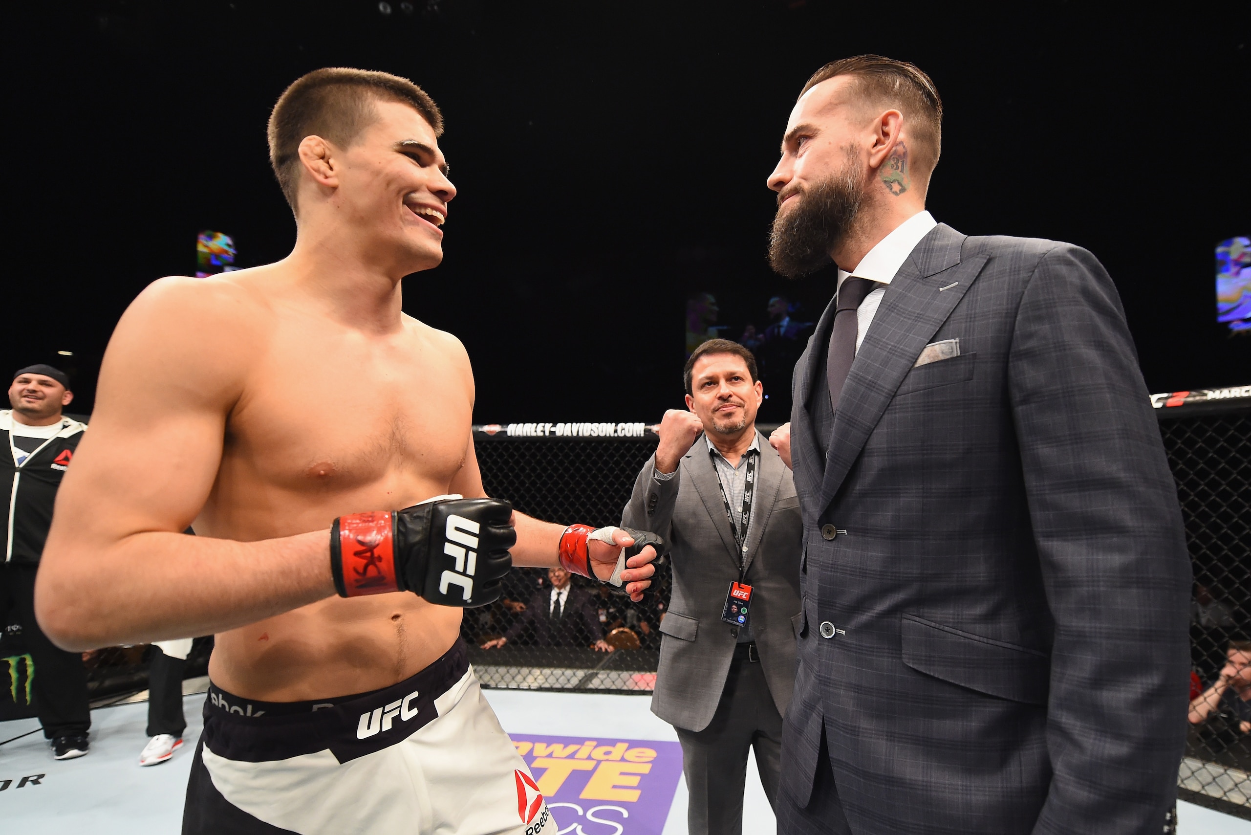 LAS VEGAS, NV - FEBRUARY 06:  (R-L) Phil 'CM Punk' Brooks faces off with Mickey Gall after Gall's victory over Mike Jackson during the UFC Fight Night event at MGM Grand Garden Arena on February 6, 2016 in Las Vegas, Nevada.  (Photo by Jeff Bottari/Zuffa LLC/Zuffa LLC via Getty Images)
