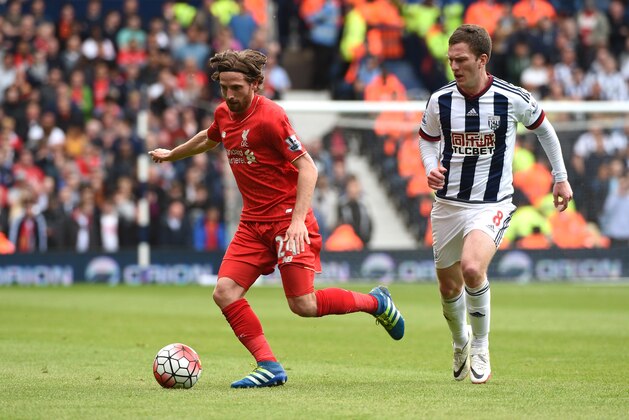 WEST BROMWICH, ENGLAND - MAY 15: Joe Allen of Liverpool and Craig Gardner of West Bromwich Albion compete for the ball during the Barclays Premier League match between West Bromwich Albion and Liverpool at The Hawthorns on May 15, 2016 in West Bromwich, England.