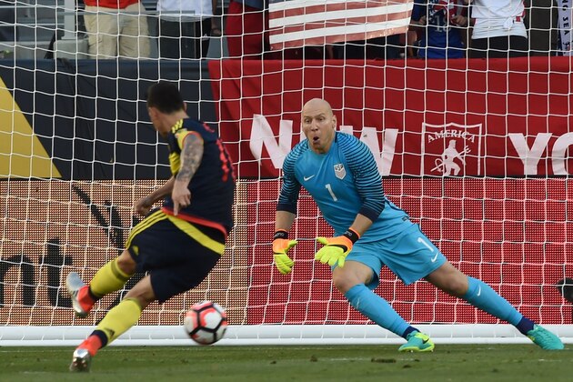 Colombia's James Rodriguez scores a penalty past USA's goalkeeper Brad Guzan during the Copa America Centenario football tournament match in Santa Clara, California, United States, on June 3, 2016. / AFP / MARK RALSTON        (Photo credit should read MARK RALSTON/AFP/Getty Images)