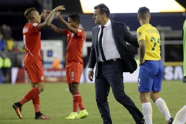 Brazil’s head coach Dunga, second from right, and Philippe Coutinho (22) leave the pitch after a 1-0 loss to Peru as Peru's Paolo Guerrero, left, and Andy Polo celebrate after a Copa America Group B soccer match on Sunday, June 12, 2016, in Foxborough, Mass. (AP Photo/Elise Amendola)