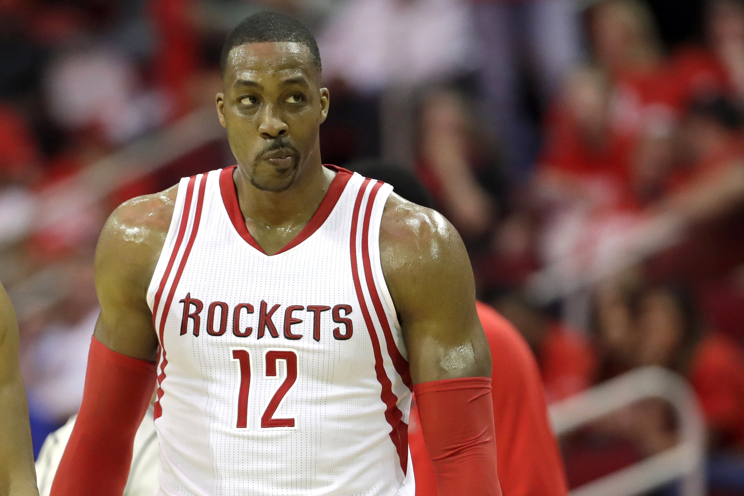 Dwight Howard pauses on the court during a timeout in the second half in Game 4 of a first-round NBA basketball playoff series against the Golden State Warriors, Sunday, April 24, 2016, in Houston. (AP Photo/David J. Phillip)