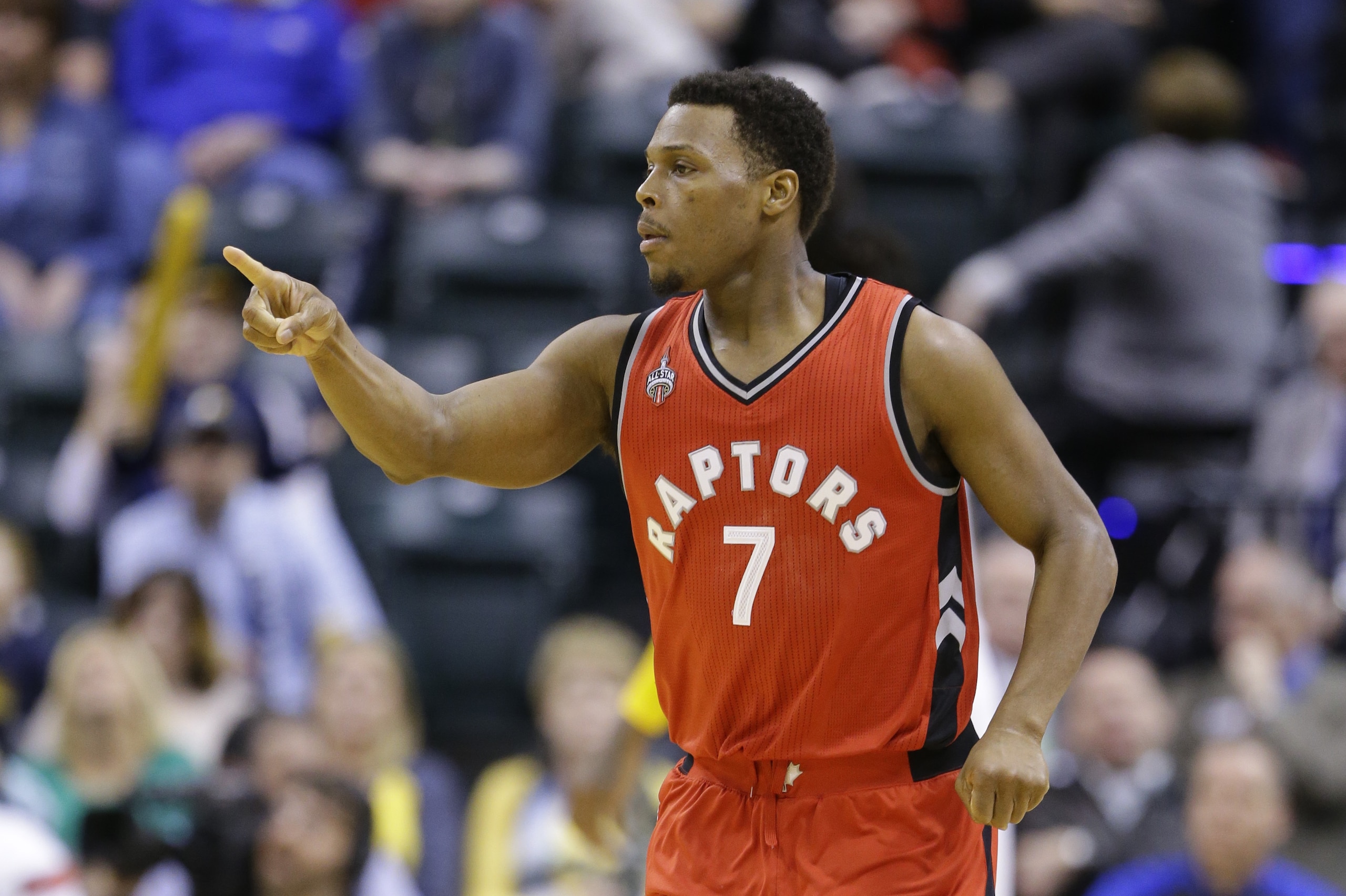 Toronto Raptors guard Kyle Lowry acknowledges an assist on a 3-point basket against the Indiana Pacers during the second half of an NBA basketball game in Indianapolis, Thursday, March 17, 2016. The Raptors defeated the Pacers 101-94 in overtime. (AP Photo/Michael Conroy)