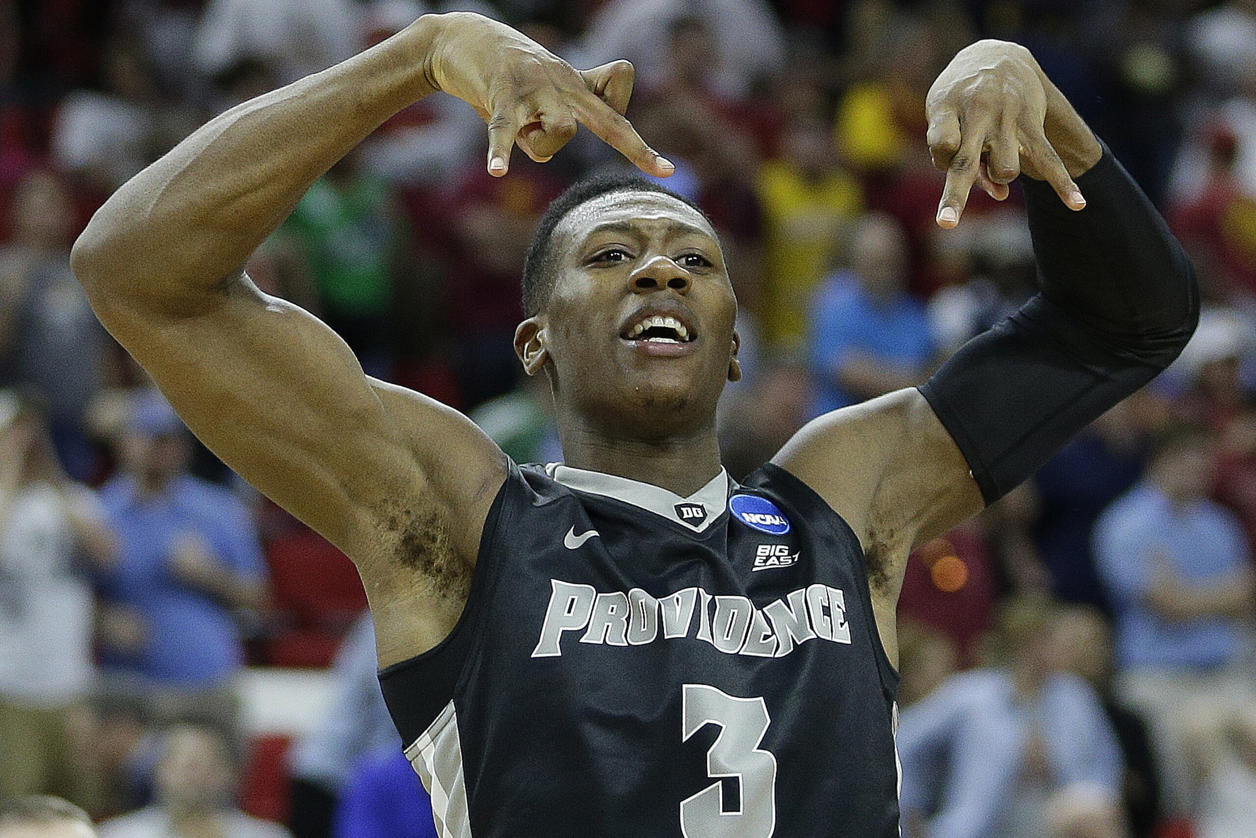 Providence guard Kris Dunn celebrates after the second half of a first-round men's college basketball game in the NCAA Tournament against Southern California, Friday, March 18, 2016, in Raleigh, N.C.  Providence won 70-69. (AP Photo/Chuck Burton)