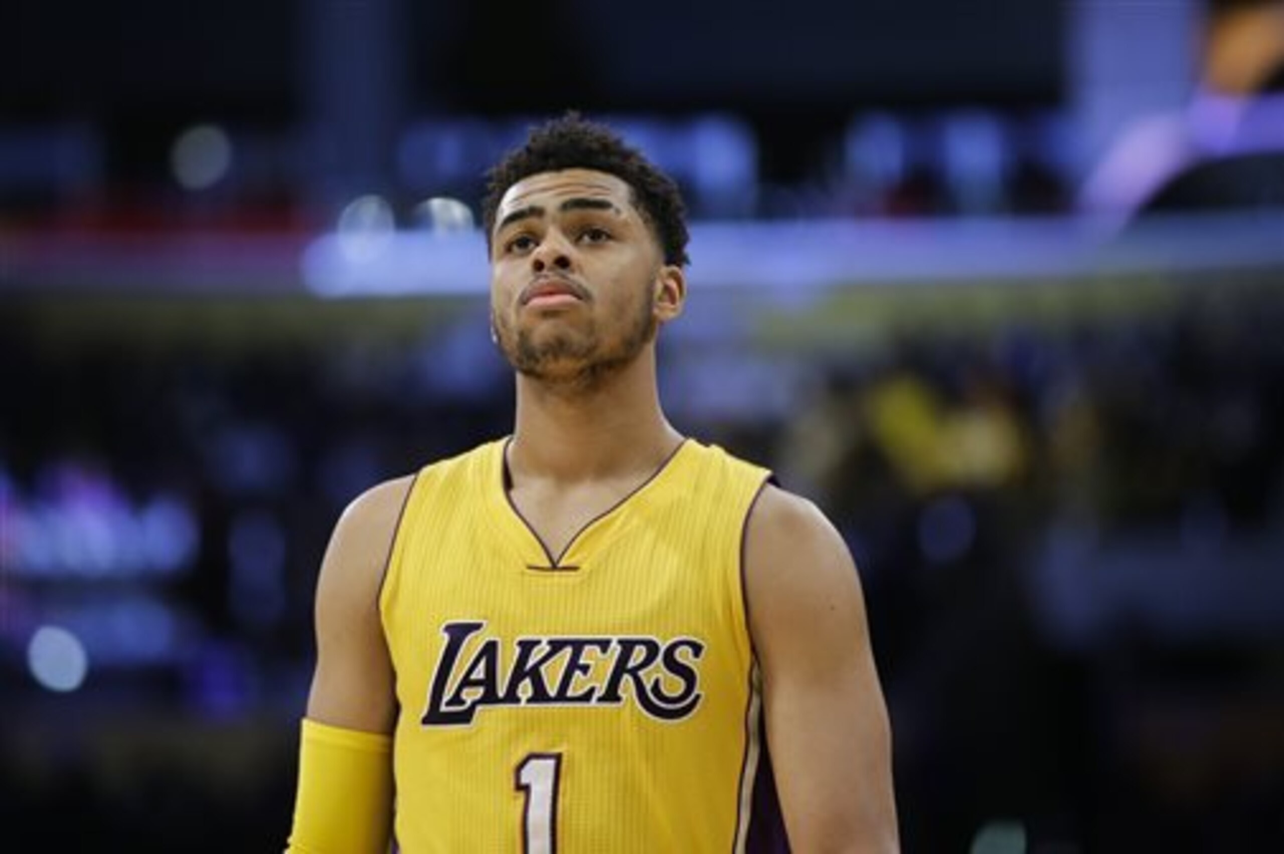 FILE - In this March 4, 2016, file photo, Los Angeles Lakers' D'Angelo Russell makes his way down the court during the first half of an NBA basketball game against the Atlanta Hawks, in Los Angeles. Lakers coach Byron Scott is