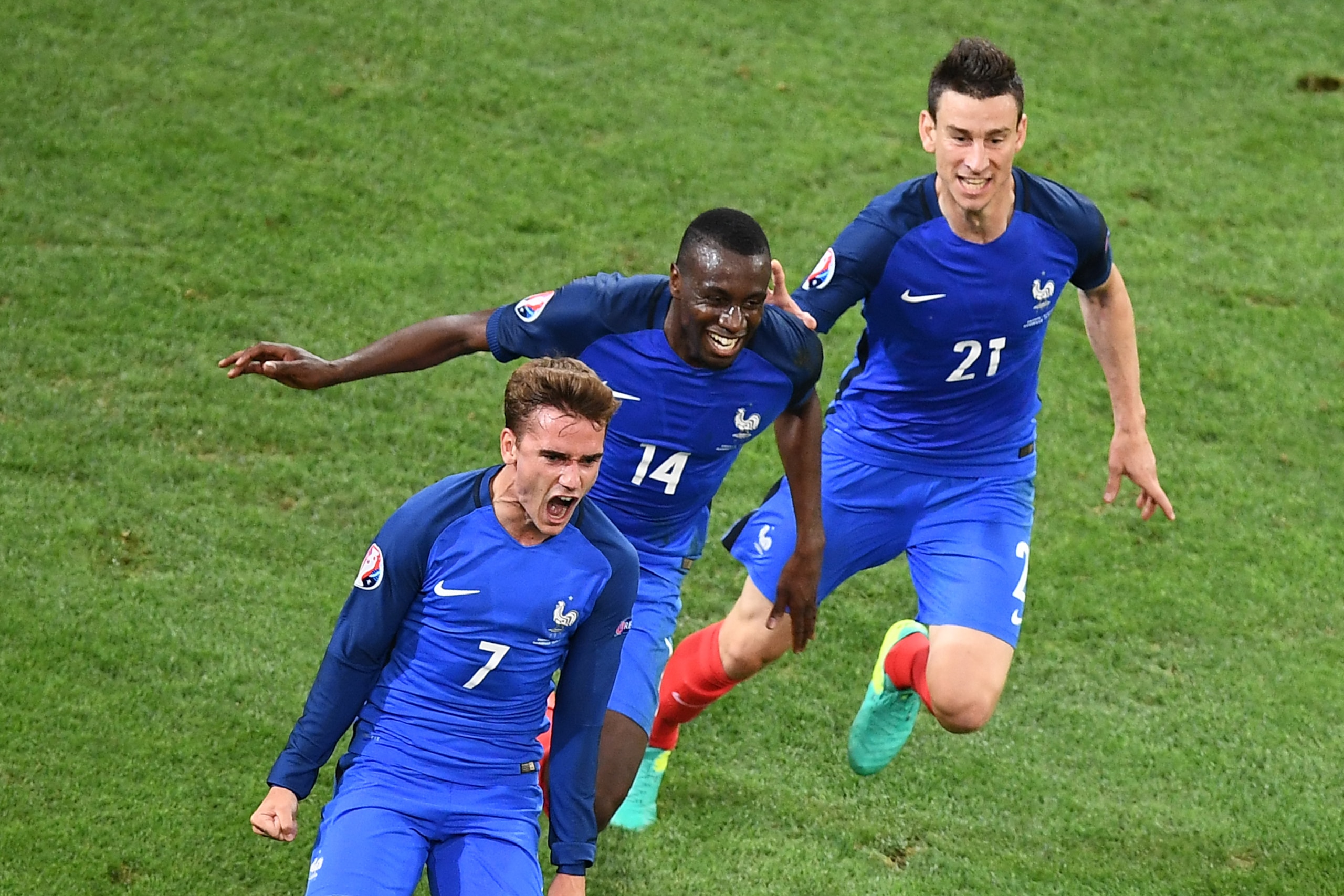 France's forward Antoine Griezmann (L) celebrates with France's midfielder Blaise Matuidi (C) and France's defender Laurent Koscielny after scoring during the Euro 2016 group A football match between France and Albania at the Velodrome stadium in Marseille on June 15, 2016. / AFP / ANNE-CHRISTINE POUJOULAT        (Photo credit should read ANNE-CHRISTINE POUJOULAT/AFP/Getty Images)