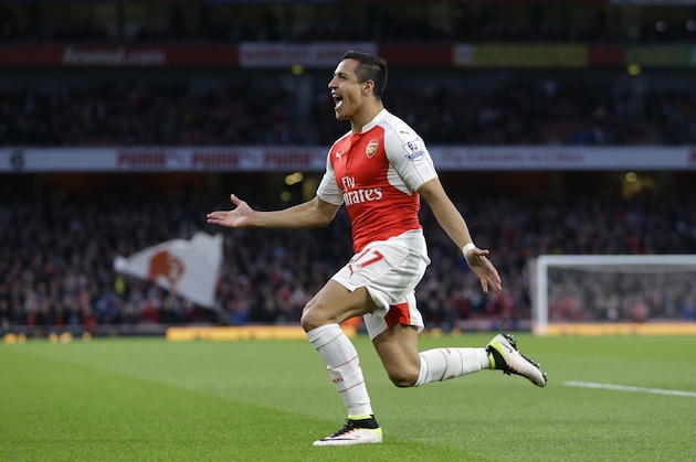 Arsenal's Alexis Sanchez celebrates scoring his side's first goal during the English Premier League soccer match between Arsenal and West Bromwich Albion at the Emirates Stadium in London, Thursday, April 21, 2016.  (AP Photo/Matt Dunham)