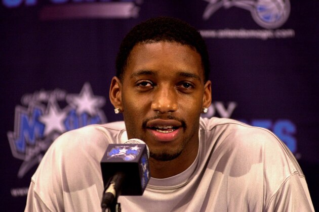 Former Toronto Raptor Tracy McGrady fields questions at a news conference in Orlando, Fla., Thursday, Aug. 3, 2000, after the Orlando Magic signed him to a contract.  (AP Photo/Peter Cosgrove)