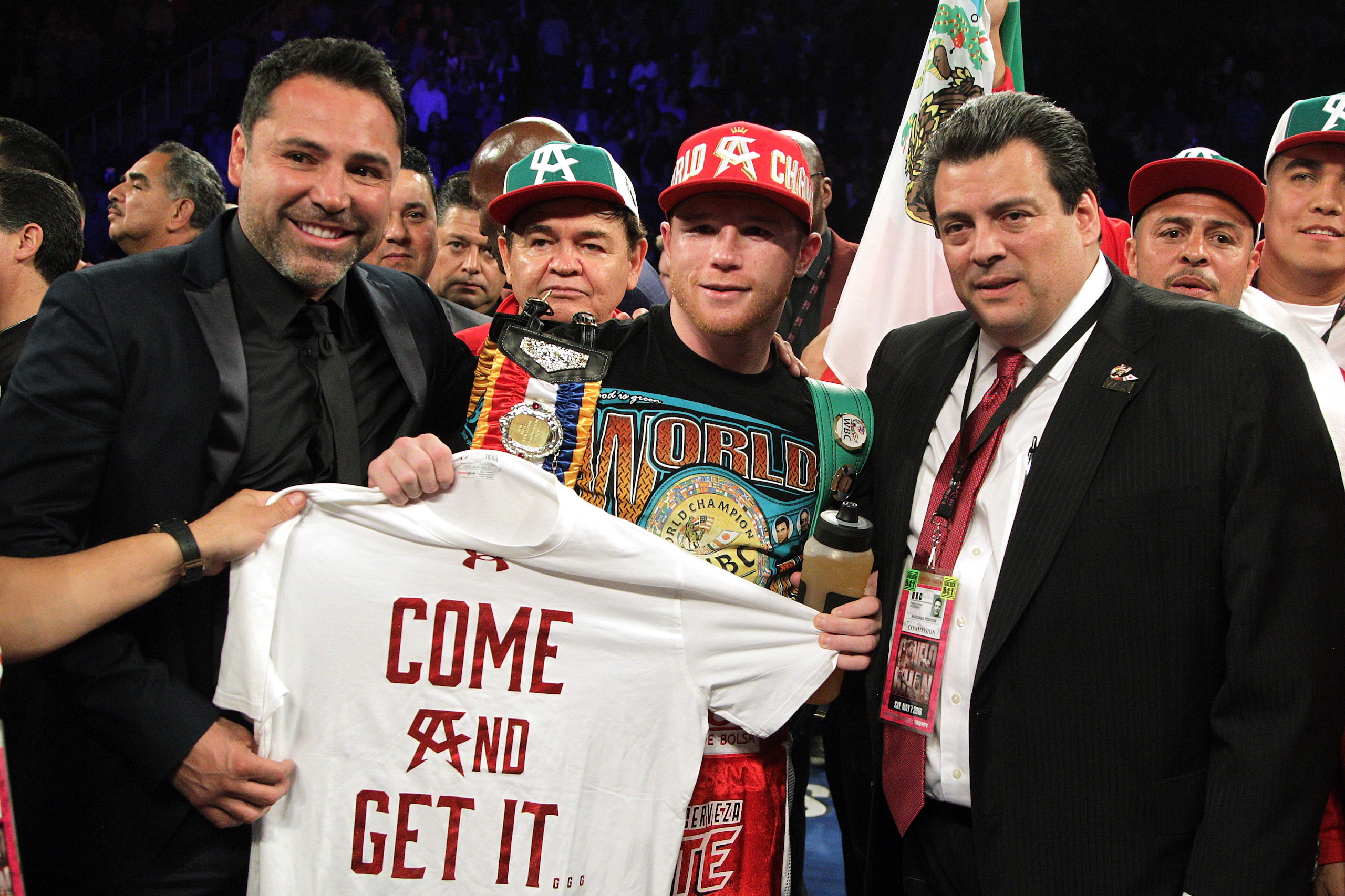 Canelo Alvarez (C) of Mexico celebrates his sixth round knockout of Britain's Amir Khan (out of frame) following their WBC middleweight title fight at T-Mobile Arena on May 7, 2016 in Las Vegas, Nevada.  / AFP / John Gurzinski        (Photo credit should read JOHN GURZINSKI/AFP/Getty Images)