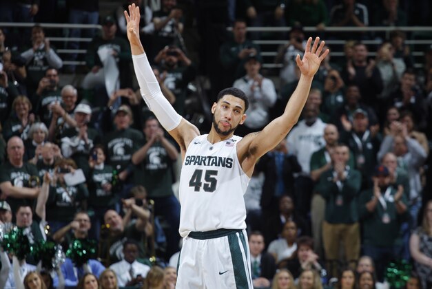 Michigan State's Denzel Valentine acknowledges the crowd as he comes out of the game in the closing minute of an NCAA college basketball game against Ohio State, Saturday, March 5, 2016, in East Lansing, Mich. Michigan State won 91-76. (AP Photo/Al Goldis)