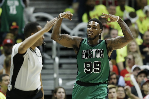 Boston Celtics' Jae Crowder, right, reacts after hitting a three-point basket during the fourth quarter in Game 1 of a first-round NBA basketball playoff series against the Atlanta Hawks Saturday, April 16, 2016, in Atlanta. (AP Photo/David Goldman)