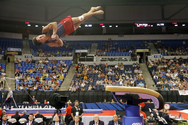 Judges below watch as Kanji Oyama competes in the vault during a the U.S men's Olympic gymnastics trials, Thursday, June 23, 2016, in St. Louis. (AP Photo/Tony Gutierrez)