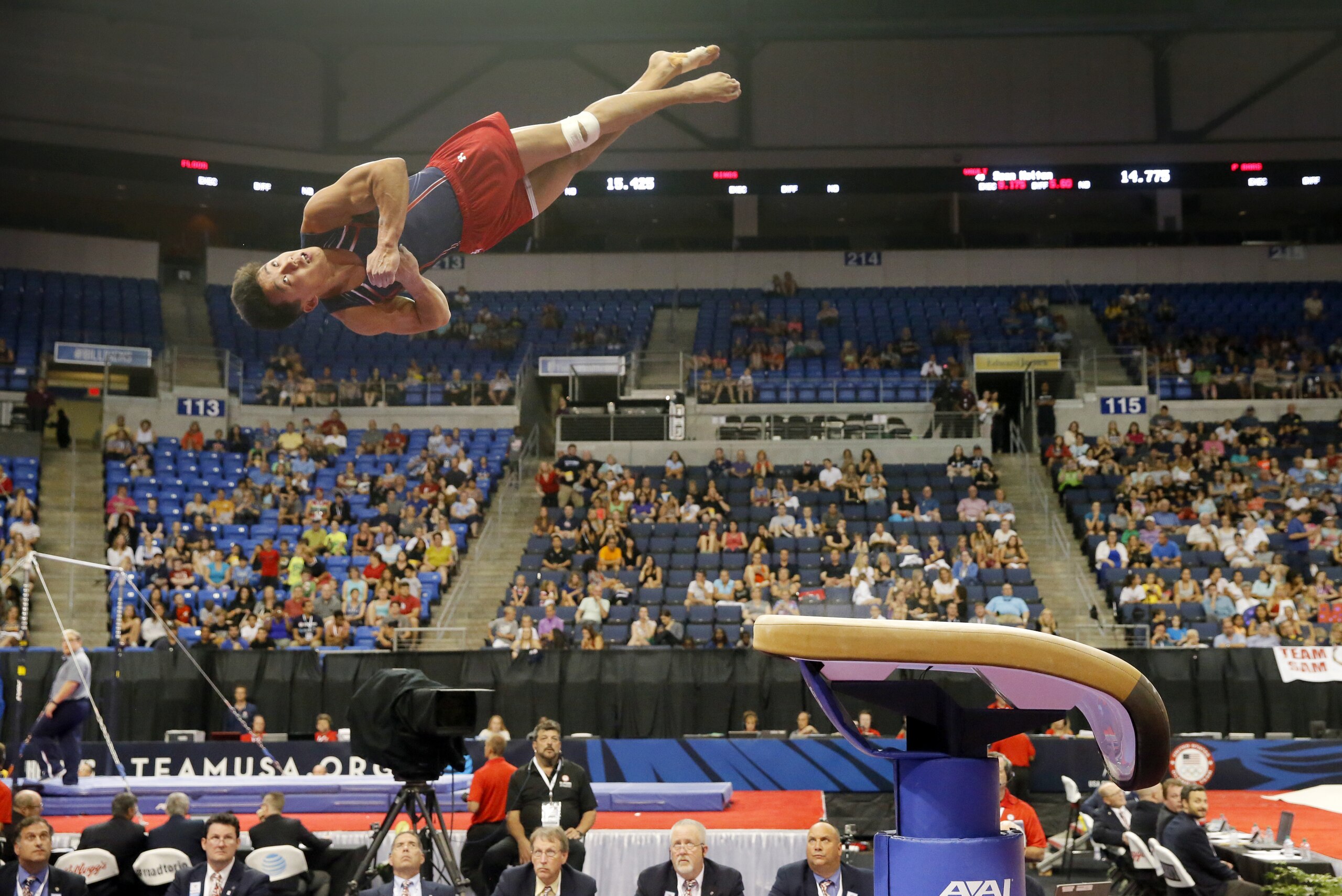 Judges below watch as Kanji Oyama competes in the vault during a the U.S men's Olympic gymnastics trials, Thursday, June 23, 2016, in St. Louis. (AP Photo/Tony Gutierrez)